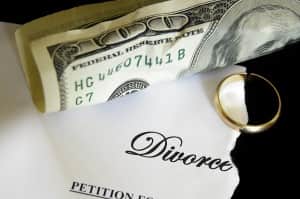 Contact Carol Romine for Indiana Divorce Mediation guidance image shows money and ring on top of divorce paper